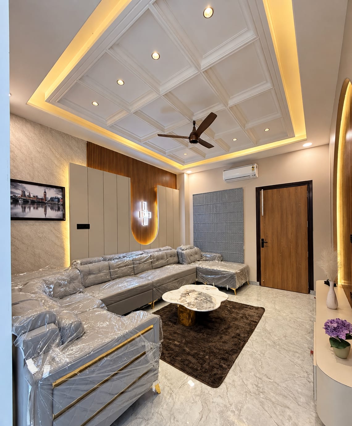 Luxury living room interior with false ceiling and wooden wall panelling by Dream Construction Kota